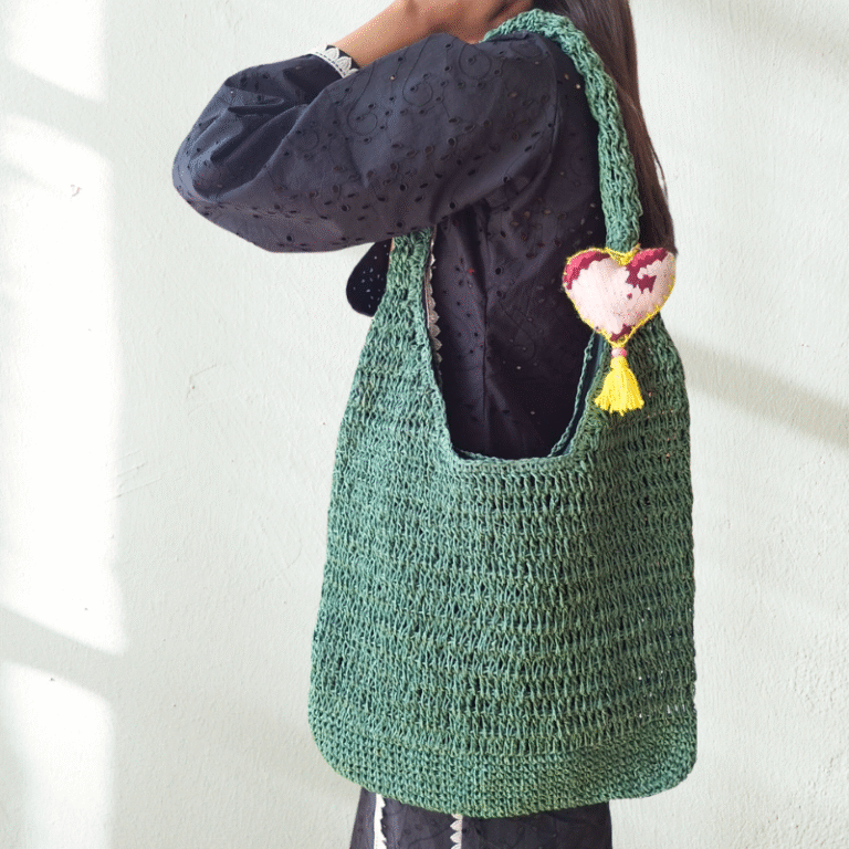 Women Carrying Kasaba Tote Bag with a handmade bag tag